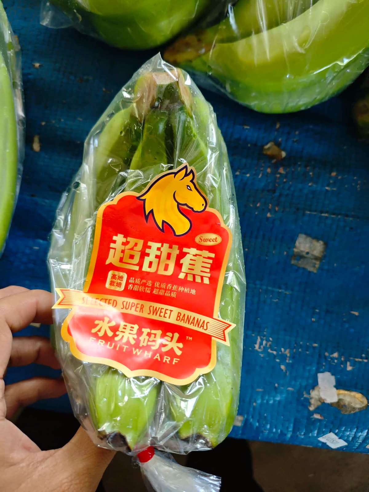 Fruit Wharf retail bag of selected super sweet bananas packed for the Chinese market